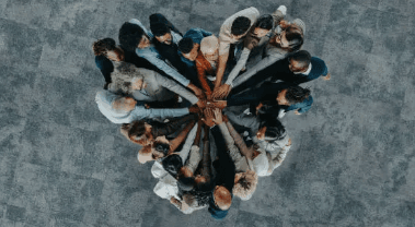 Team hands joined in collaboration